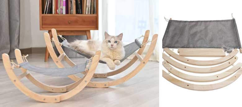 wooden cat hammock with a white kitty on it 