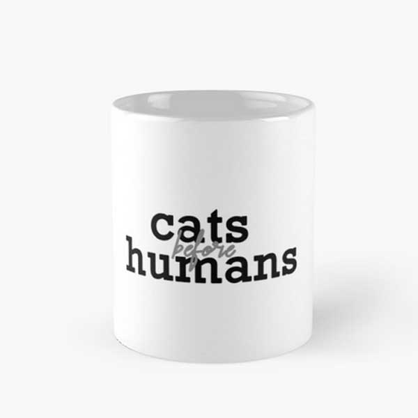 A cat coffee mug with a cute saying 