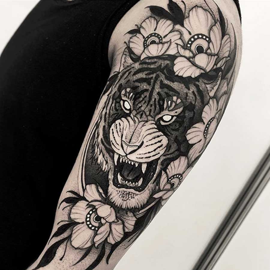 A wild cat black and white tattoo by Franki Tattoo