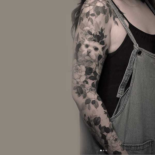 Sleeve cat tattoo with flowers, black and white by K U B R I C K   H O