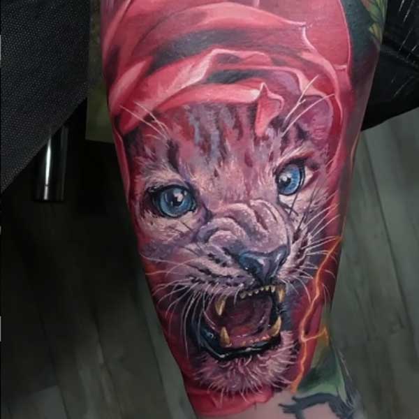 A wild cat color tattoo by Dmitriy Samohin