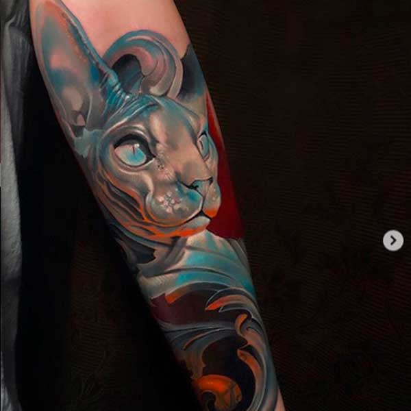 Colour sphynx face tattoo by Tomas Šaray