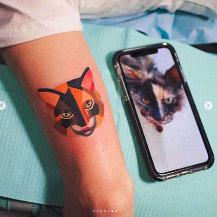 A geometric cat tattoo by Sasha Unisex