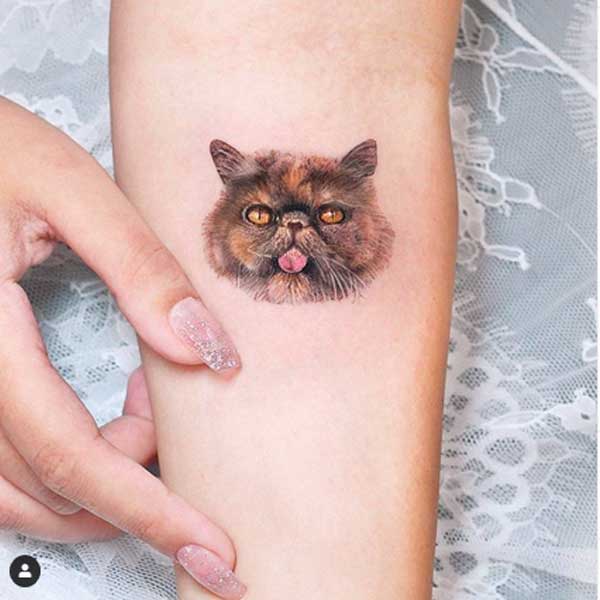 Minimalist simple cat face tattoo by Edit Paints Tattoo