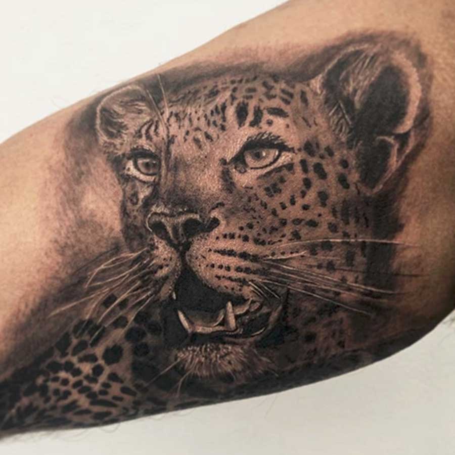 Traditional big cat tattoo by London Inkaholics