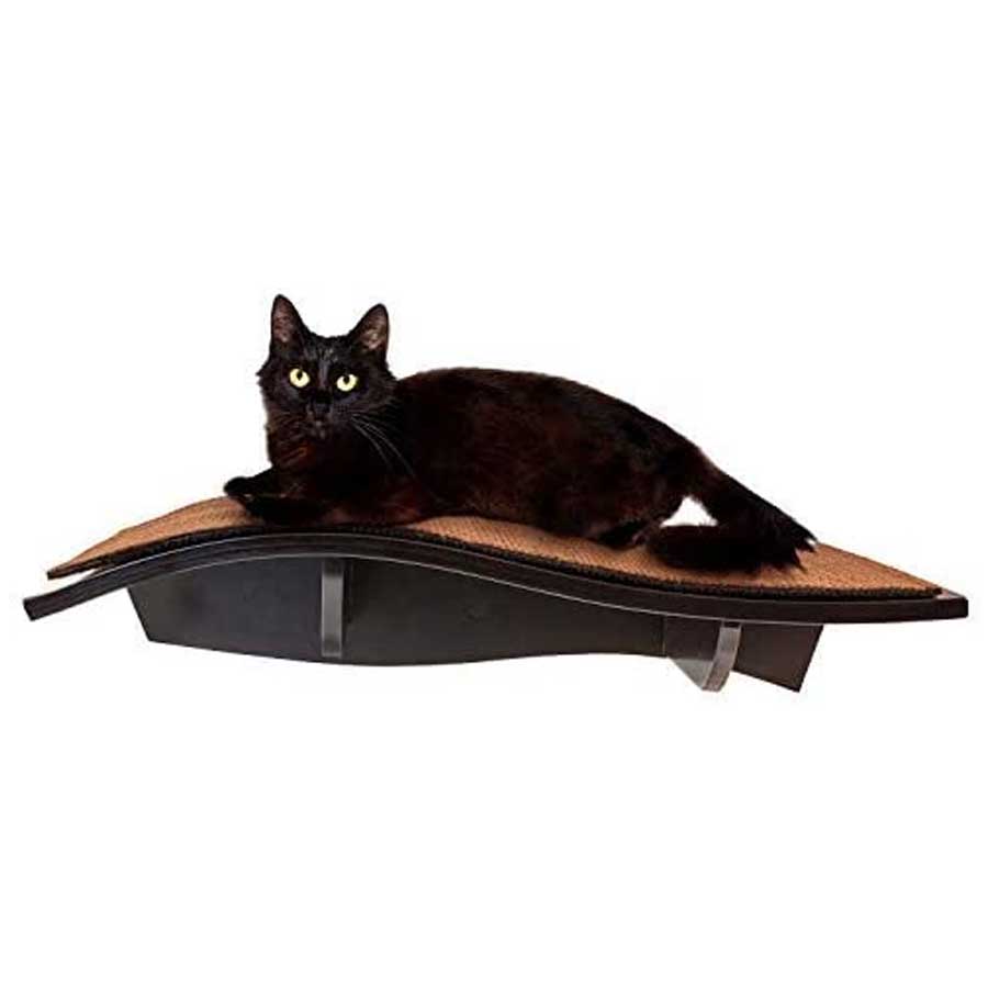 A black cat who is happy lying on wooden shelf