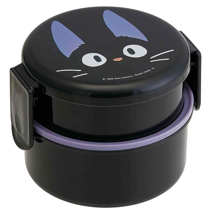 Two black plastic containers, connected with two hinges. The magical black cat's face from Kiki's Delivery Service can be seen on top.