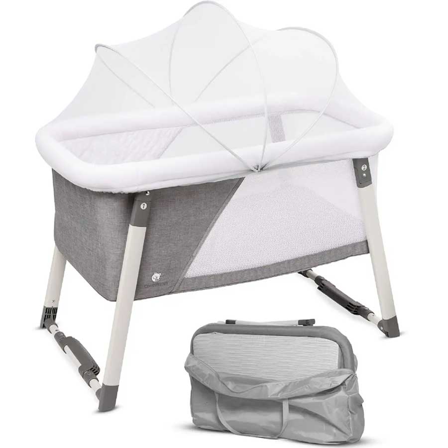 A white and gray bassinet for newborn babies with a gray travel bag 